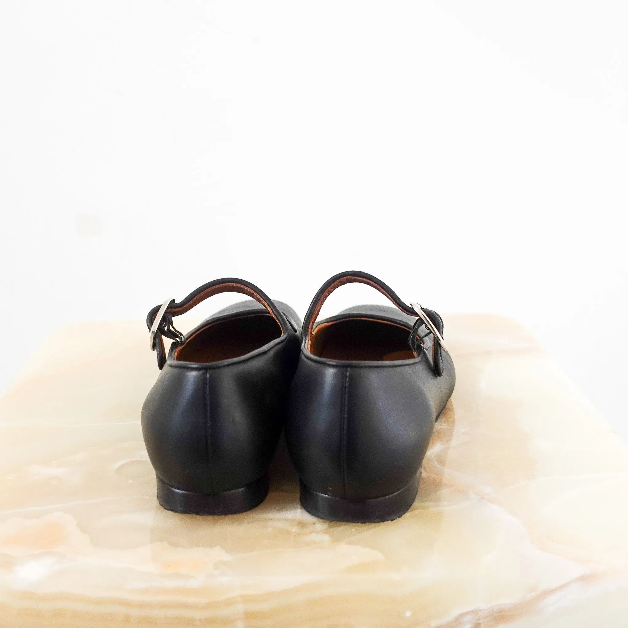 Black flat mary janes RRP £395